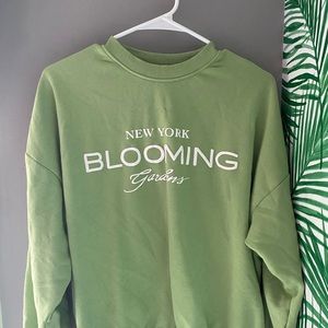 green destination crewneck
